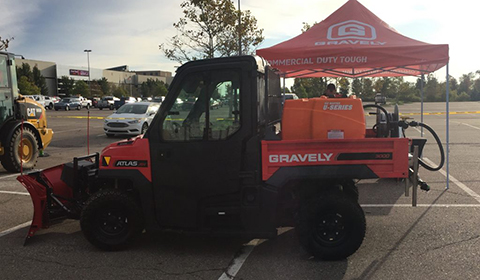 Showing Gravely Atlas JSV UTV with Ice Master Systems tank and Western plow installed, at Construction Show of Michigan Show