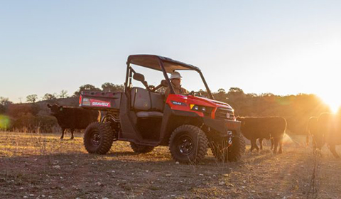 Showing Gravely Atlas JSV UTV being used on farm for agriculture