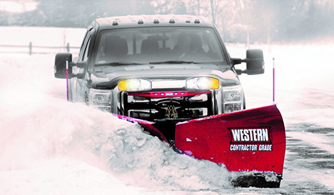 Western snowplows v-plow on pickup truck plowing snow Abco Truck Equipment Toledo Ohio and Michigan