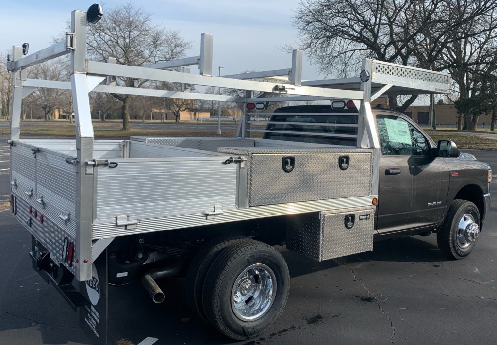 Showing a picture of Duramag aluminum contractor work truck body with ladder rack and truck toolboxes on commercial truck chassis installed by abco truck equipment Toledo ohio and Michigan